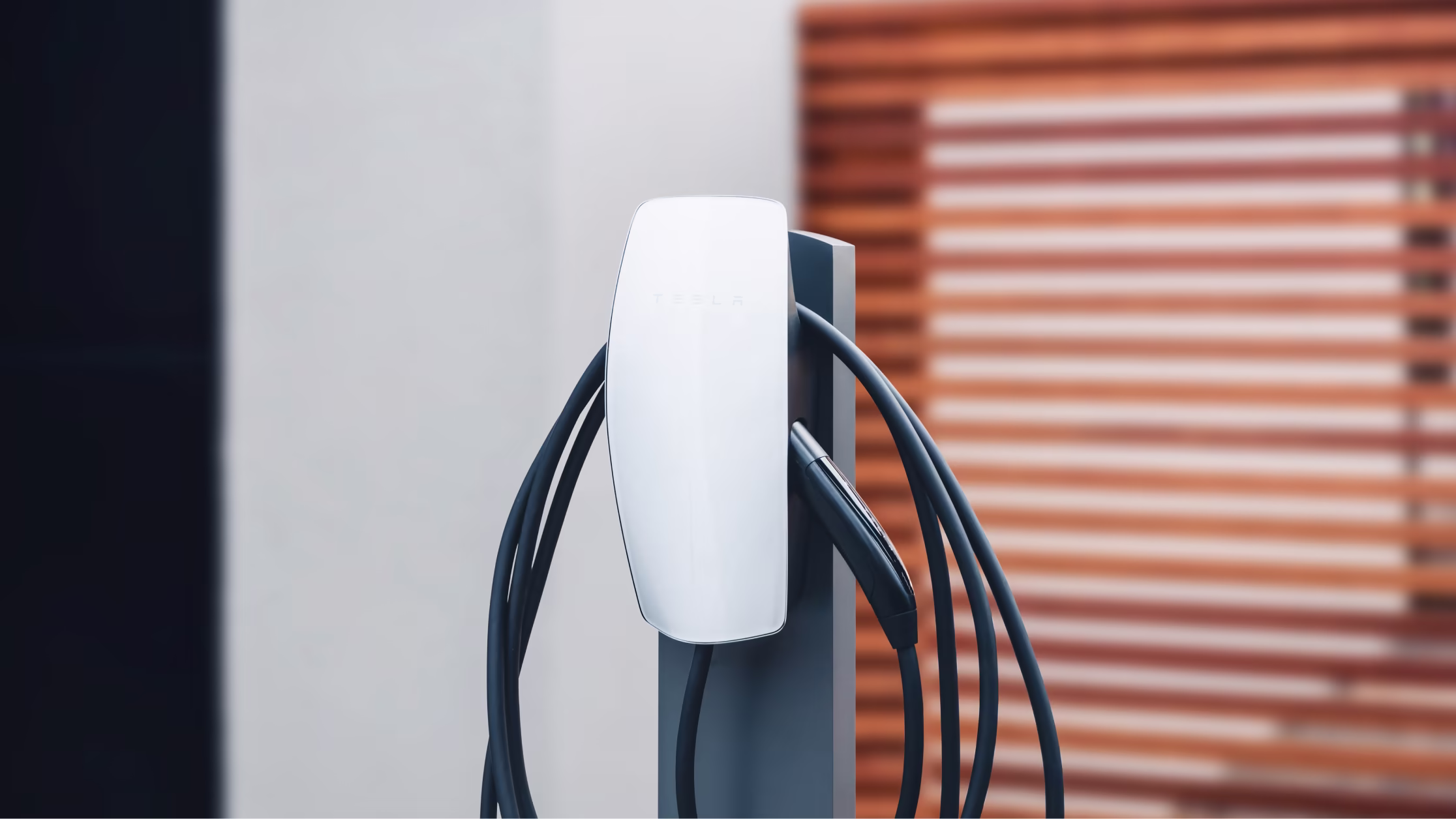 Tesla Wall Connector on a pedestal at a property